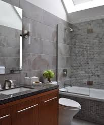 Weve a white small bathroom with dark brown high cabinet, mirror cabinet and wall tiles, grey floor tiles bathroom white vessel shape free standimg bathtub undermount sink frameless wall mirror dark gray tile walls. 33 Modern Interior Design Ideas Emphasizing White Brick Walls Bathroom Interior Design Grey Bathroom Tiles Brown Tile Bathroom