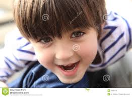 Happy and cute young boy - happy-cute-young-boy-smiling-looking-directly-up-camera-33291701