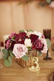 A nest flower and egg arrangement with daffodils, hyacinths and tulips and speckled eggs is ideal as an easter centerpiece. Burgundy And Blush Boho Floral Wedding Garland Arch Flower Etsy Gold Wedding Centerpieces Burgundy Wedding Centerpieces Wedding Centerpieces