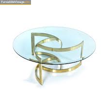 The brass base on our coffee tables pops beautifully against deep colors such as navy or charcoal. Gold Spiral Coffee Table With Circular Glass Top On Brass Base