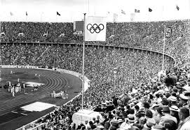 Jesse owens on the podium after winning the long jump at the 1936 summer olympics in 1931 the ioc selected the german capital city berlin as the host city of the 1936 summer olympics. 1936 Summer Olympics Simple English Wikipedia The Free Encyclopedia