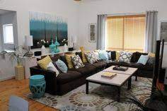 The chair and its coffee table are focal point in living room. Living Room Colors Living Room Ideas Brown Colors Dark Couch Brown Couches In Living Room Brown Living Room Decor Living Room Turquoise Brown Living Room