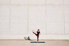 Demoing the moves is devon stewart, a yoga instructor and sexual and reproductive. Trendy Fit Female Athlete In Sportswear Doing Extended Hand To Big Toe Yoga Pose On Sports Mat While Training Alone On Street Full Length Practice Stock Photo 357488566