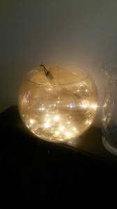 Fairy Lights And Organza In A Glass Fish Bowl Lovely Soft Lighting To Add A Warm Glow To A Dark A Wedding Table Centerpieces Centerpieces Wedding Centerpieces