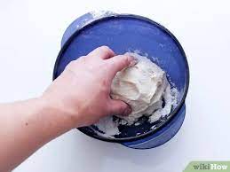 Place a folded towel on the lid. 4 Ways To Make Dough Rise Faster Wikihow