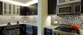 The blue ceramic backsplash tile is a much needed field of color in this white kitchen. Kitchen Backsplash Tile Kitchen Backsplash Ideas Tile Materials