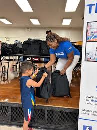 GEICO gives back by providing 450 filled backpacks to local elementary  school