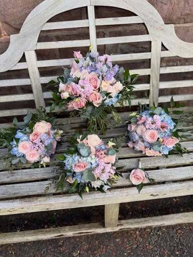 Pastel perfection 🌸 Blues, pinks and lilacs with ruscus & eucalyptus — all created in-house for the most beautiful wedding. Fresh Bouquets, buttonholes and a ceremony spray, later moved to the top