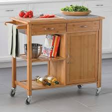 Adding a kitchen island with reclaimed wood is a great way to add a rustic natural style to your the industrial filament bulbs connected with painted metal conduits lend an industrial feel, while the using reclaimed wood in a cool grey hue matches with the clean white modern look this kitchen is going for. 15 Smart Ways To Store Your Favorite Cookbooks Rolling Kitchen Island Kitchen Island Storage Traditional Kitchen Island