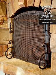 We also have decorative mesh panels and steel shower curtains. Fireplace Doors Custom Architectural Ironwork Blacksmith Dragon Forge Ltd