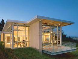 Open floor plans are a signature characteristic of this style. Small Glass House Design