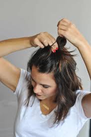 Take one section and pin it down, under the ponytail, and take the other section and pin it up, on top of the ponytail. How To Do The Half Top Knot On Short Hair An Indigo Day