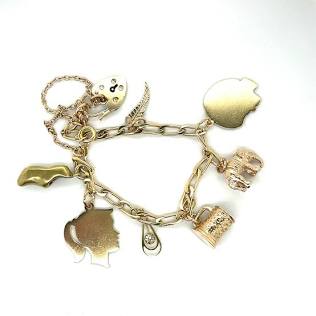 A vintage gold charm bracelet, where every charm represents a distinct memory., AI generated