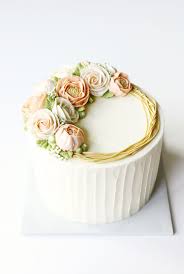 Beautifully smooth swiss meringue buttercream in pastel colours are swirled into a flush floral finish. Cake Trends Blooming Buttercream Cake Decorating Buttercream Cake Cupcake Cakes