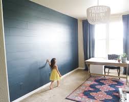 The faux woodgrain distressed background offers a soft neutral gray color palette that will blend well with any outdoor décor. Diy Dark Shiplap Wall Tutorial For Beginners Making Home Pretty