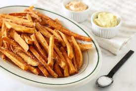 A Cornstarch Bath Is The Secret To Crispy Sweet Potato Fries Recipe Sweet Potato Fries Baked Crispy Sweet Potato Fries Sweet Potato Fries