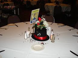 Simple Table Centerpiece With Top Hat And Flowers And A Playbill Table Sign Top Hat Centerpieces Mitzvah Centerpieces Birthday Table Decorations