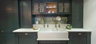 Granite countertops at the range and island, with the island bar featuring a beautiful glass countertop. Ex Display Kitchens Appliances Charlie Kingham Surrey