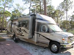 Front living, rear bedroom, center kitchen, center bathroom; Jayco Melbourne 32 Ft Class C Recreational Vehicles Jayco Rv Living