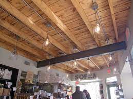 Rustic Exposed Beam Ceiling In A Shop Basement Ceiling Exposed Basement Ceiling Exposed Beams Ceiling