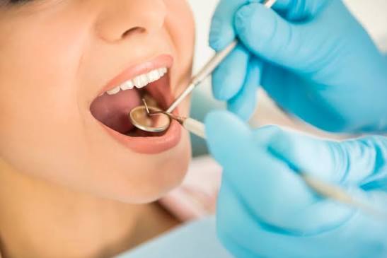 Dentist reviewing treatment progress with patient at Profrea