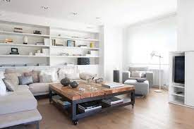 In its simplest form, a coffee table is a wooden board usually about 18 inches wide by 36 inches long on top of a base usually about 15 inches tall, although these dimensions may vary. 39 Large Coffee Tables For Your Spacious Living Room