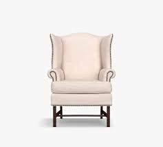 These chairs are pretty in person and fairly comfortable. Thatcher Upholstered Wingback Chair Pottery Barn