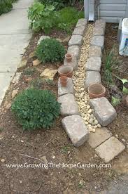 Making A Dry Creek Bed Drainage Canal For Downspouts One Of The Most Creative Ideas I Ve Seen For This Project Lawn And Garden Garden Garden Projects