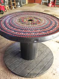 Bottle Cap Mosaic On An Electrician S Spool Table I Caulked The Grooves Between The Boards Then Painted The Tabl Spool Furniture Spool Tables Beer Cap Table