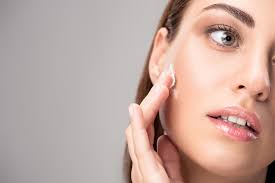 What is the best face moisturizer for women? Beautiful Woman Applying Face Cream On Perfect Skin Isolated On Grey Free Stock Photo And Image