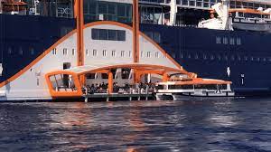 When most people imagine a cruise ship docking, they probably picture it sliding into an illustrious port, before a gangway is lowered to allow its passengers to disembark. Wheelchair Accessible Cruise Ship Tendering On The Celebrity Edge Magic Carpet Spin The Globe