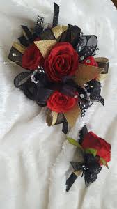 Black And Gold Flowers Arrangements Black Gold And Red Prom Corsage From Hen House Designs Www Henhousedesigns Net Gold Corsage Prom Prom Corsage Red Prom Corsage And Boutonniere