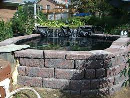 To strengthen, the boundaries of the pond lay the retaining wall blocks on the top of the concrete building blocks. Allen Block Koi Pond Pond With Waterfall Pond Waterfall