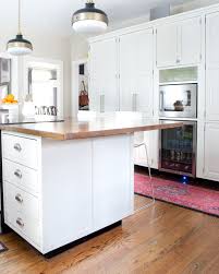 Cabinet doors updated with molding. How To Add Detail To A Plain Kitchen Island The Chronicles Of Home