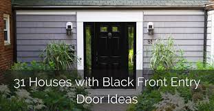 Black front door with white sidelights flanked by black carriage lanterns and potted plants. 31 Houses With Black Front Entry Door Ideas Sebring Design Build
