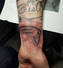 Cracked skin information including symptoms, diagnosis, treatment, causes, videos, forums, and local community support. Wonderful Engraved Cracked Skin New England Patriots Tattoo On Wrist