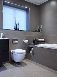 The wooden flooring in this gray bathroom is in herringbone patterns, adding style to the entire interior. Modern Bathroom Design Ideas From Lighting Design To Color Choice Home Tree Atlas Gray Bathroom Decor Bathroom Interior Design Small Bathroom Remodel