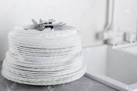 stack of clean plates with forks