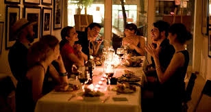 Beautiful smiling woman enjoying dinner party at home. Rules Of Civility How To Host A Dinner Party