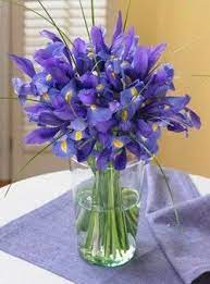 She Knows Why You Need Flowers In Your Home Iris Bouquet Iris Flowers Flower Arrangements