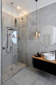 For smaller rooms like bathrooms, try using smaller tiles to make the room look larger. Bathroom Tile For Bathroom White Porcelain Sink Rectangular Frameless Medicine Box Mirror With Wooden Modern Bathroom Modern Bathroom Lighting Trendy Bathroom