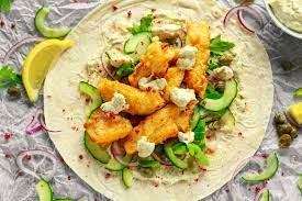 Season with jalapeno, capers, oregano, cumin, dill, and cayenne. Fresh Fish Tortilla With Cucumber Red Onion Capers Lemon Stock Photo Picture And Royalty Free Image Image 84852683
