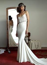 With glittering gold beading in a classic deco design, and swinging black fringe, this spectacular 1920s flapper dress is pure elegance. Photo Via Project Wedding Art Deco Wedding Dress Wedding Dresses Wedding Dress Inspiration