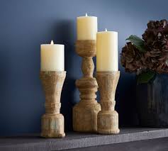Maybe you would like to learn more about one of these? Ava Natural Wood Pillar Candleholders Pottery Barn