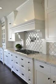 Beautiful Kitchen Idea With Colonial White Granite White Arabesque Tile White Cabinets And Kitchen Remodel Small White Kitchen Design White Kitchen Interior