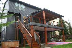 The patio below is protected with underdecking and. Happy Valley Main Floor Remodel Modern Deck Portland By Fouch Building Remodeling Deck Renovation House Deck Patio Deck Designs