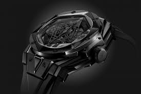 Being of the color black, producing or reflecting comparatively little light and having no predominant hue. The Big Bang Unico Sang Bleu Ii All Black Gets Inked In Black Hublot