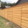 Board and batten privacy fence. 1