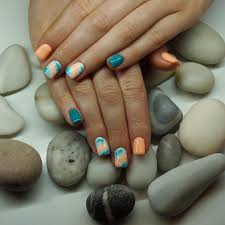 Peach acrylic nail design, this acrylic nail design has a peach background, and black and white dots. Light Peach Acrylic Nails New Expression Nails