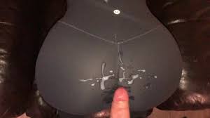 Cumming all over the ass of her leggings and rubbing it in